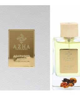 Azha Agarwood Amber perfume bottle with gold label and beige cap, on a white background.