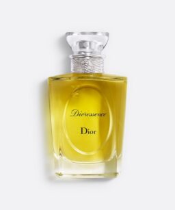 Dior Diorecence perfume bottle with yellow fragrance liquid and elegant glass cap.